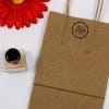 An example of the 1 inch stamp impression on a bag