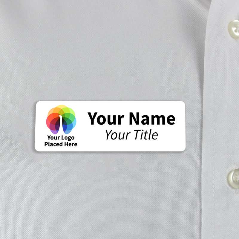 White 1x3  inch name tag - sample template - worn on a off-white dress shirt for size perspective