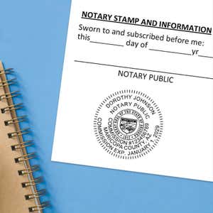 Arizona notary stamp impression on jurat form next to spiral notebook on blue background.