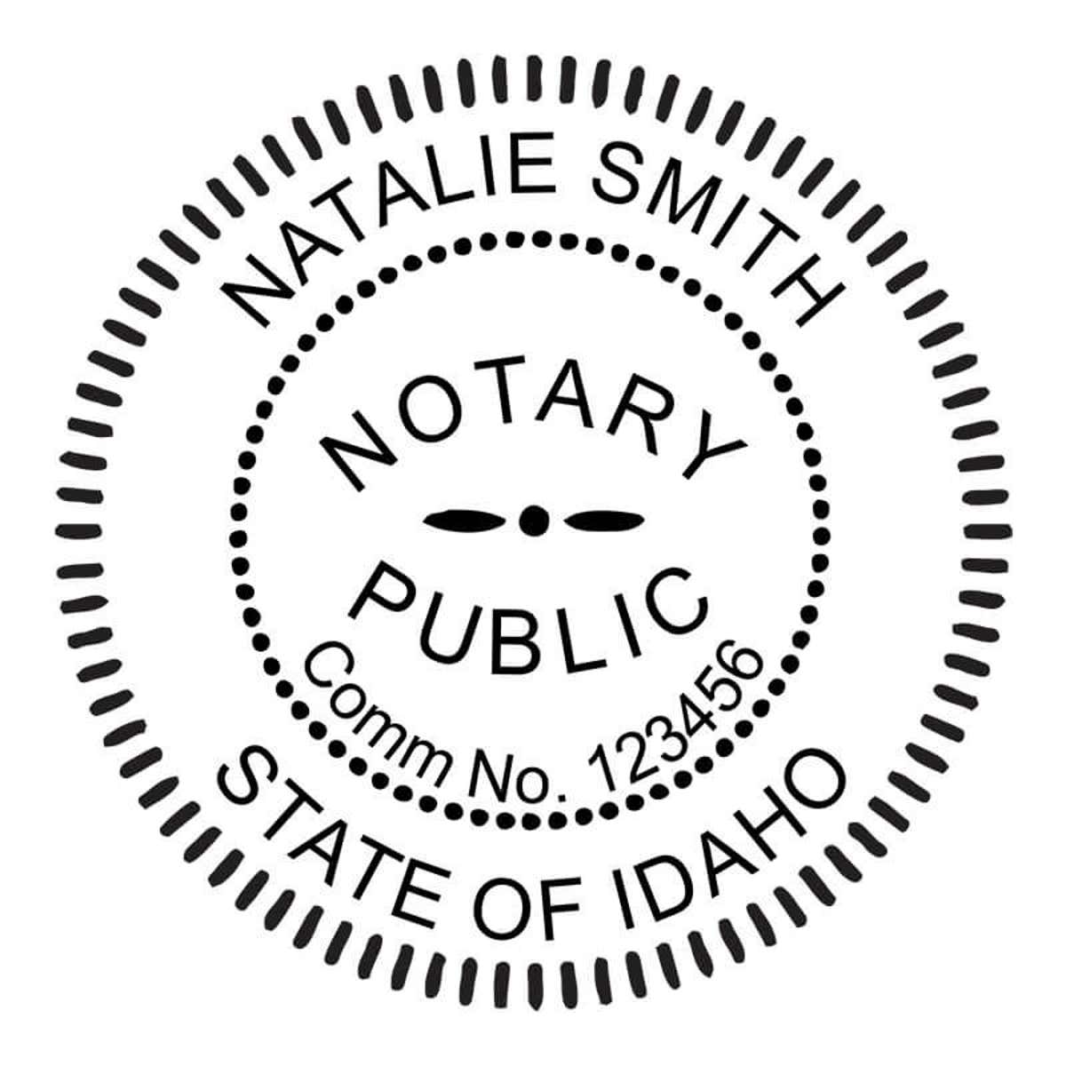 Round Idaho notary public stamp next to black and white self-inking stamp.