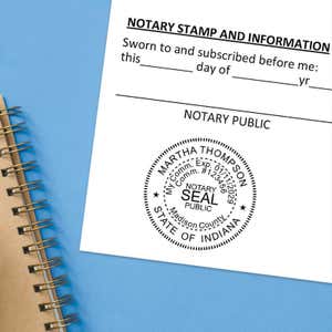 Indiana notary seal impression on jurat form with spiral notebook on blue background.