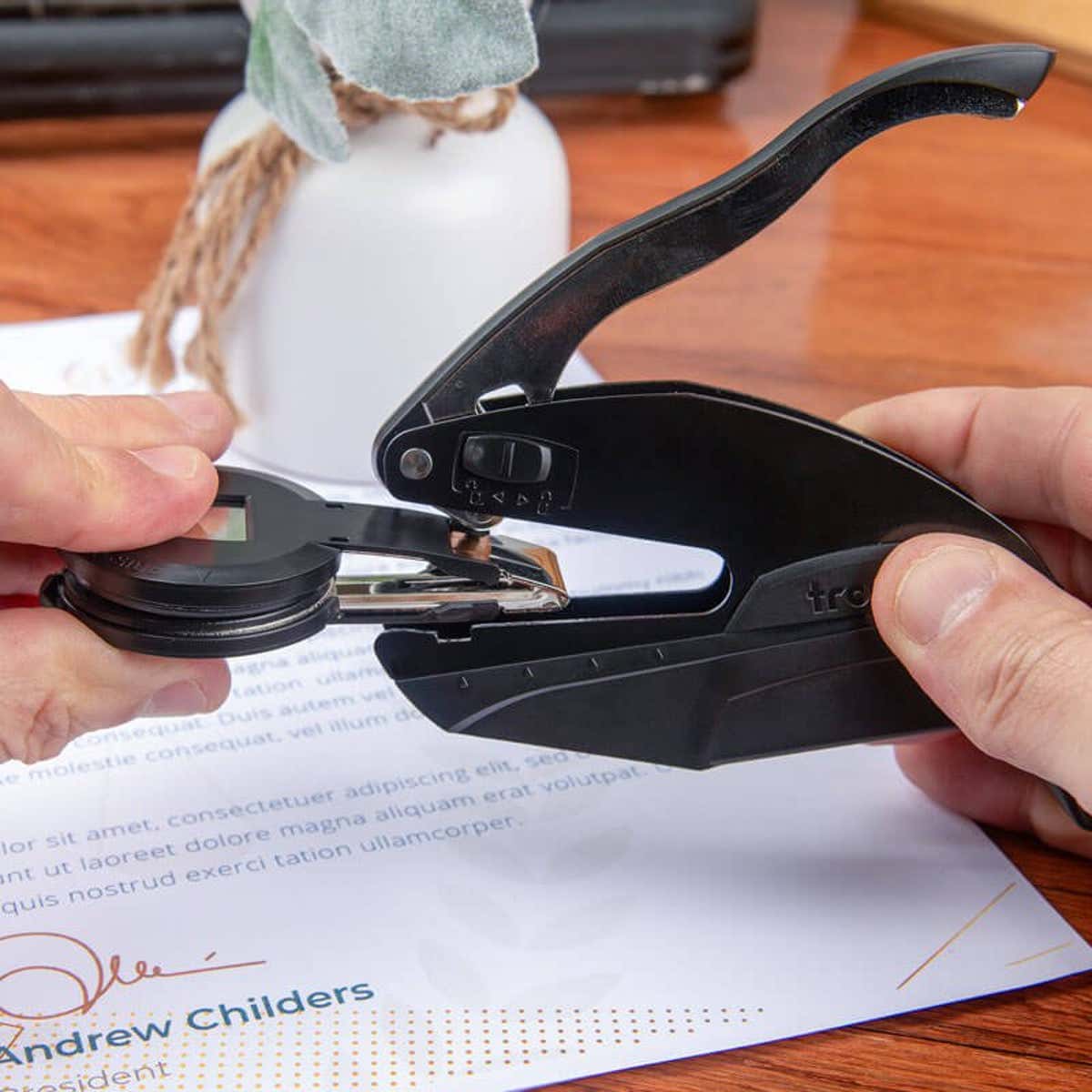 Demonstration of embosser being inserted