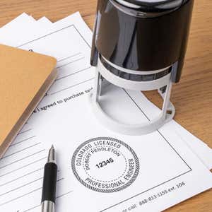 A self-inking stamp being used for the State of Colorado Engineer Seal