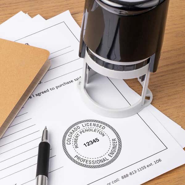A self-inking stamp being used for the State of Colorado Engineer Seal