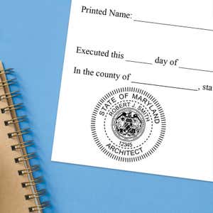 Maryland notary stamp impression on white paper on a blue notebook. 