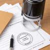 The State of Missouri Architect Seal at the bottom on a document next to a self-inking stamp