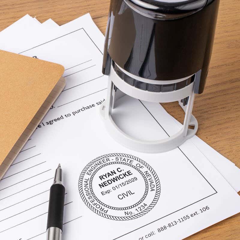 The State of Nevada Engineer Seal on a document next to a self-inking stamp