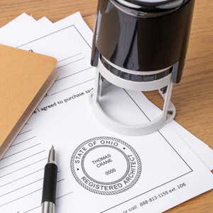 The State of Ohio Architect Individual Seal on a document next to the self-inking stamp
