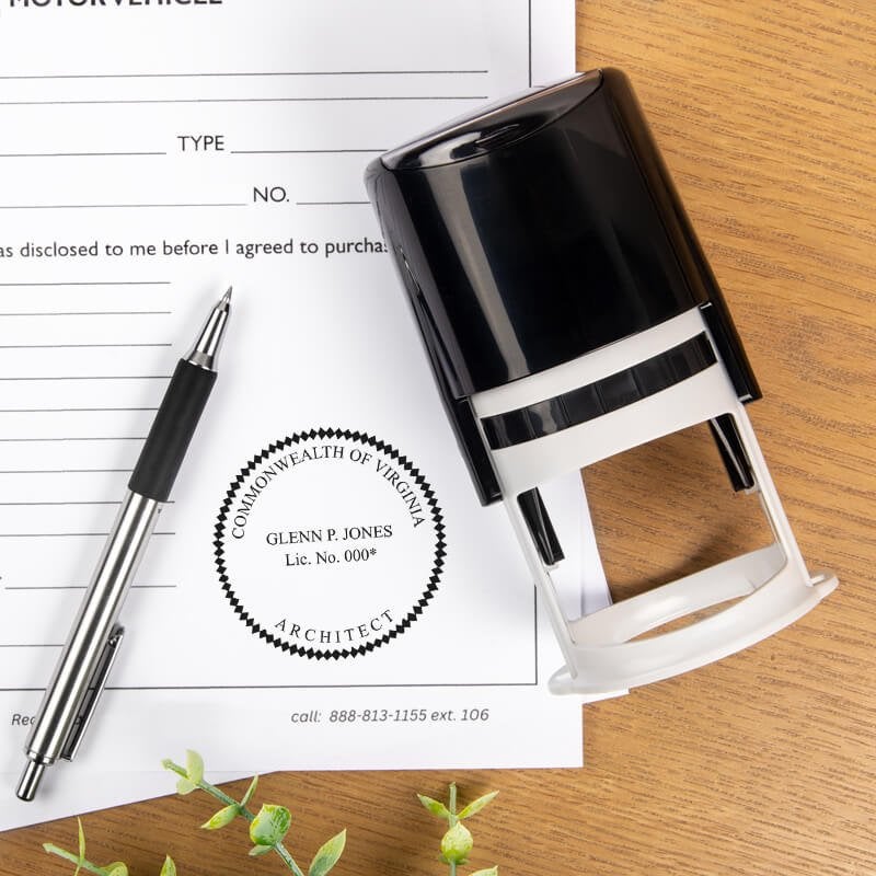 The State of Virginia Architect Seal on a document next to a self-inking stamp and a pen