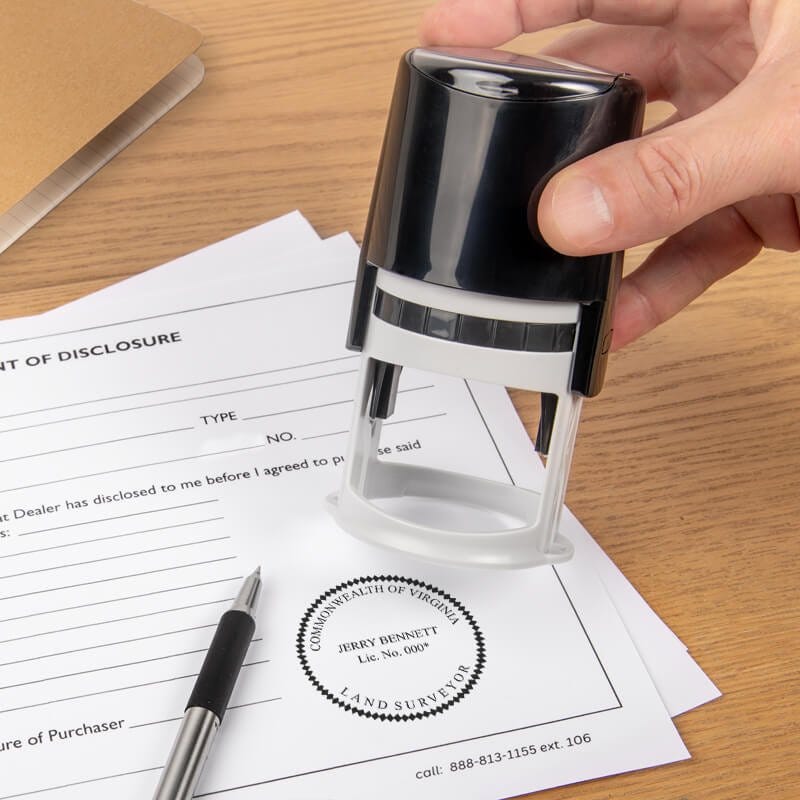 The State of Virginia Land Surveyor Seal being used on a document with a self-inking stamp