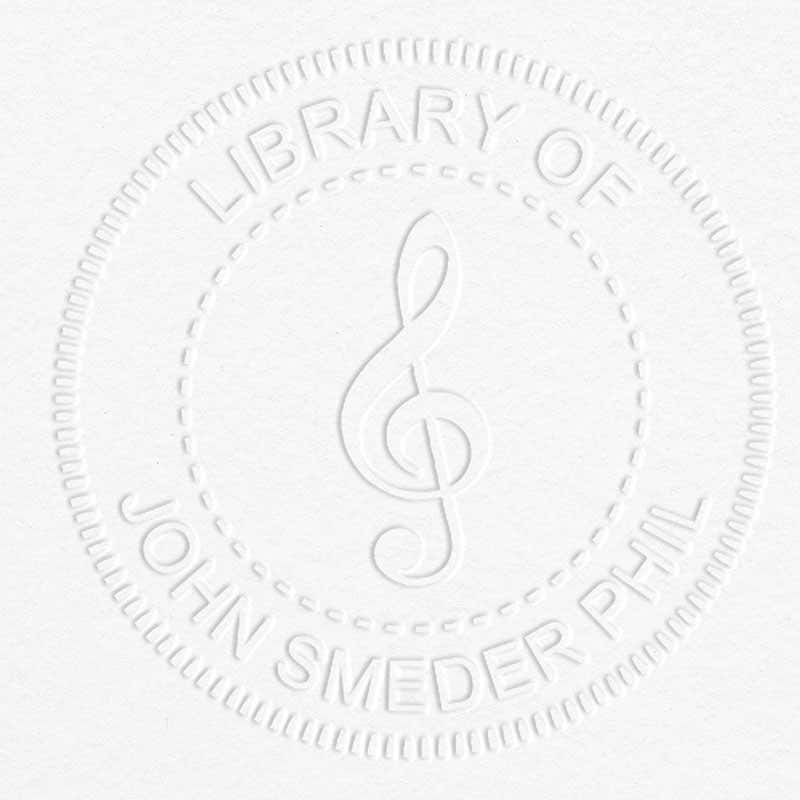 Treble Clef Music Symbol Embosser impression on grey paper