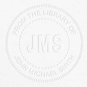 Example of From the Library Initials Personalized Book Embosser Imprint on grey paper