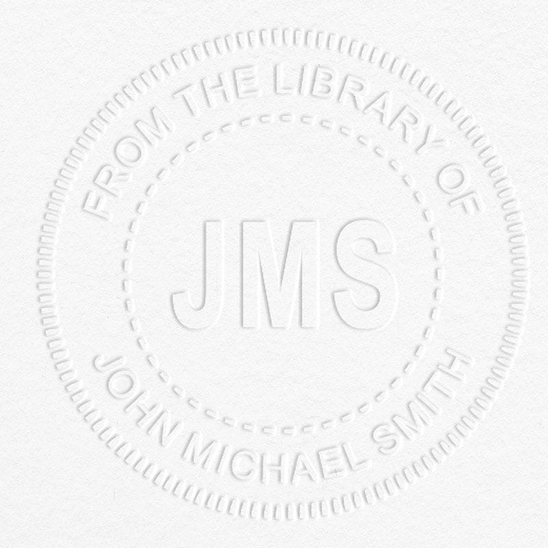 Example of From the Library Initials Personalized Book Embosser Imprint on grey paper