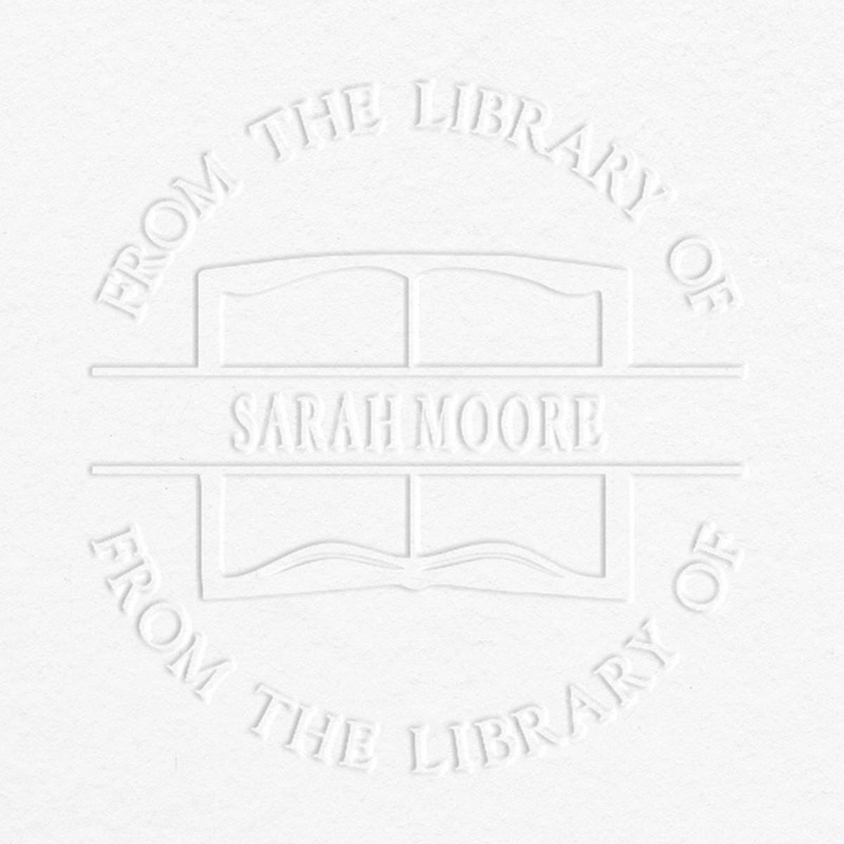 Example of From the Library Book Name Embosser Impression on Grey Background