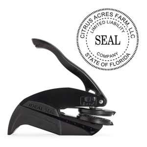 The Limited Liability Company Seal Embosser with Year is pictured with the Pocket Seal by Trodat.