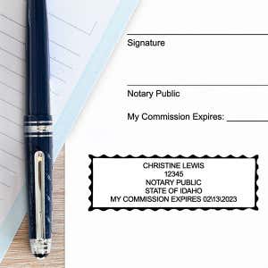 Example of impression next to pen and paper