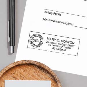 Another example of the Indiana Notary Pink Stamp - Rectangle impression next to a pen