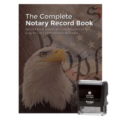 Notary record book with bald eagle cover beside a black self-inking notary stamp body.