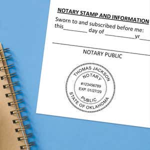 Stamped notary seal on a document next to a spiral notebook on a blue background.