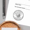 California Notary Pink Seal Embosser - Round Impression on Paper