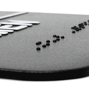 Close up of the Braille on an ADA sign