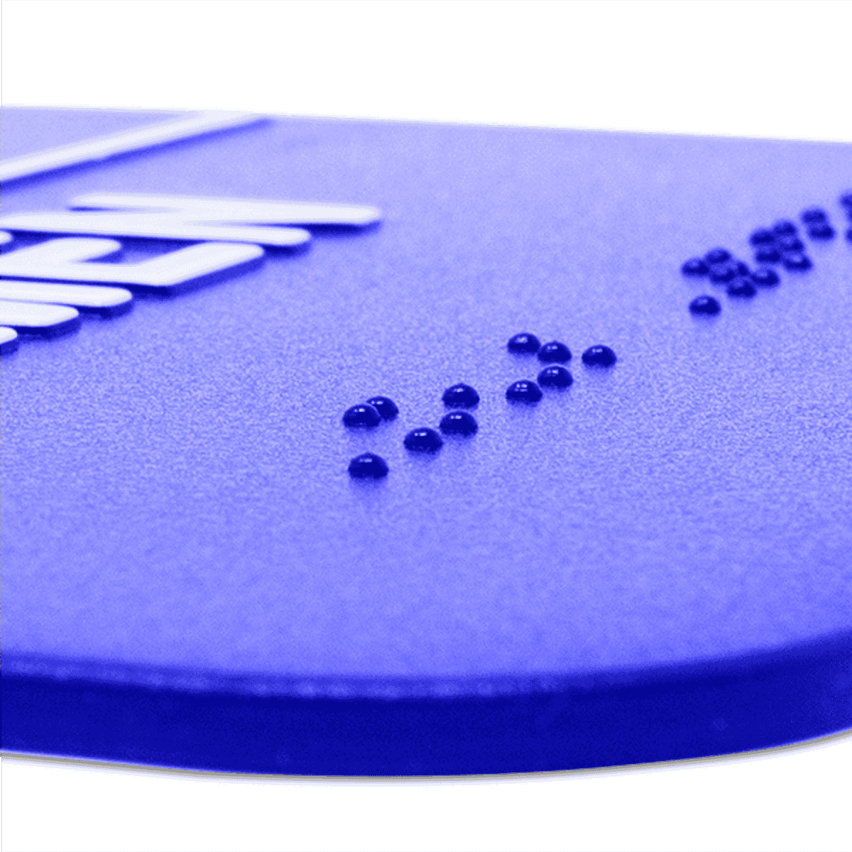 Close up of the braille on the ADA restroom sign