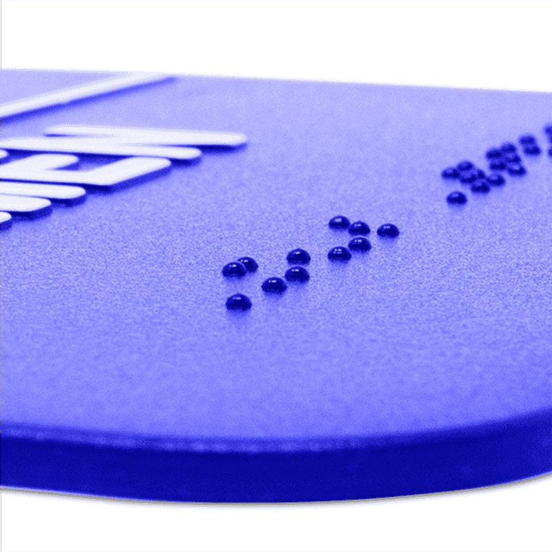 Close up of the braille on the ADA restroom sign