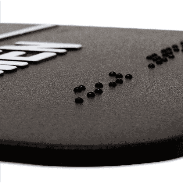 Close up of the Braille on the ADA sign