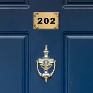 Custom engraved Brass Sign on a Door