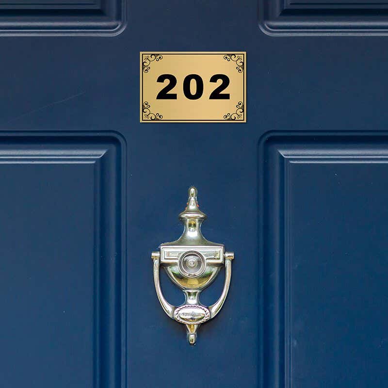 Custom engraved Brass Sign on a Door
