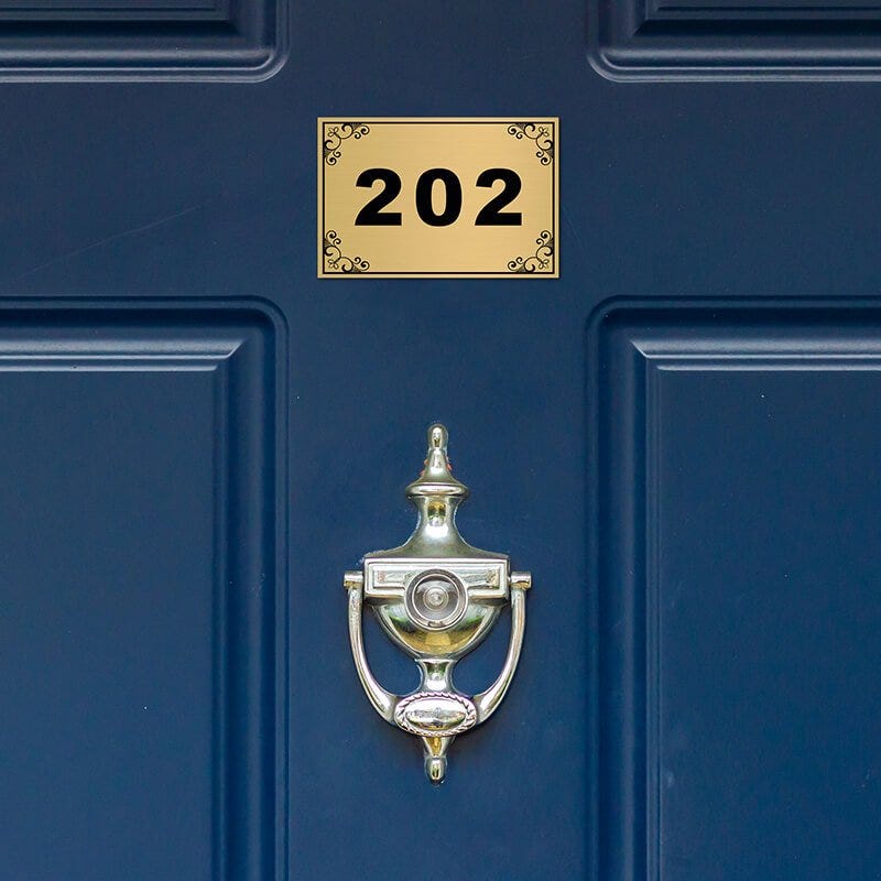 Custom engraved Brass Sign on a Door