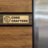 3x10 custom engraved brass sign displayed on a wall