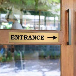 3x16 custom engraved brass sign on a door
