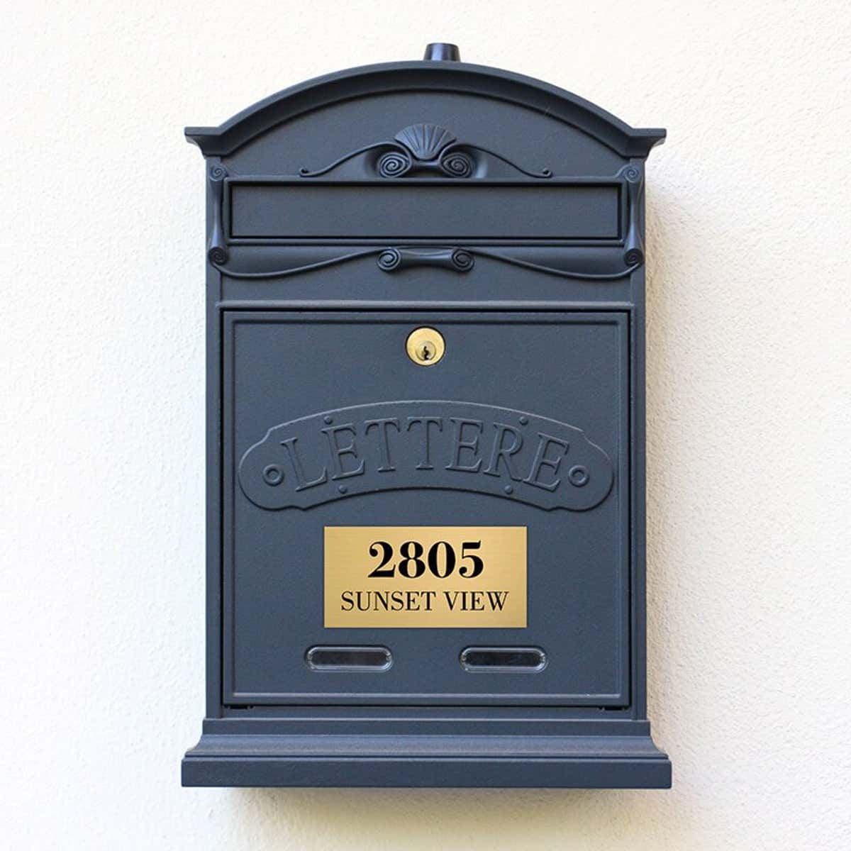 3x6 custom engraved brass sign on a gray mailbox