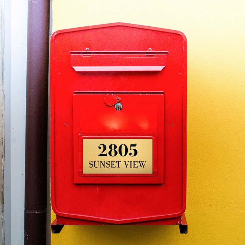 3x6 custom engraved brass sign on a red mailbox