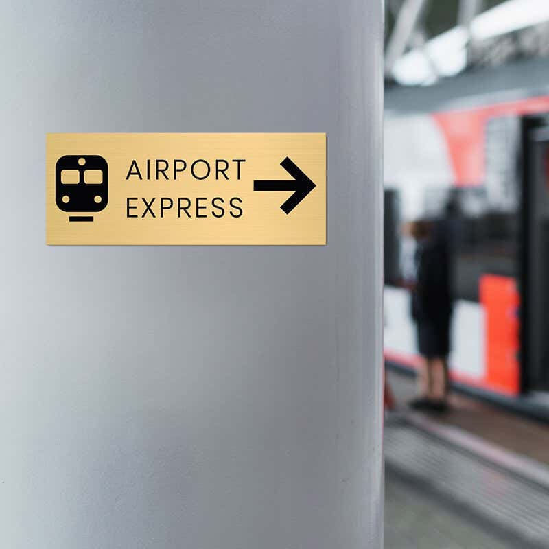 4x10 custom engraved brass sign displayed in an airport
