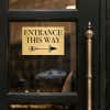4x6 custom engraved brass sign displayed on a door