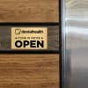 6x10 custom engraved brass sign displayed on a wall