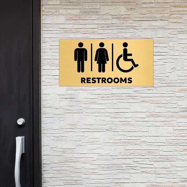 6x12 custom engraved brass sign displayed by a window