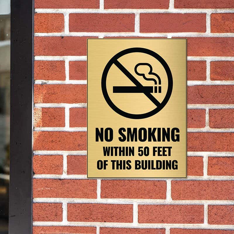 14x10 engraved brass sign on a brick wall