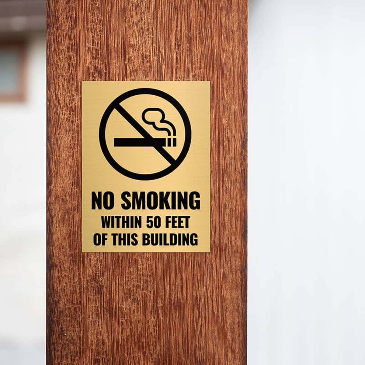 4x3 custom engraved brass sign displayed on a pillar 