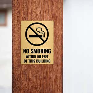 4x3 custom engraved brass sign displayed on a pillar 