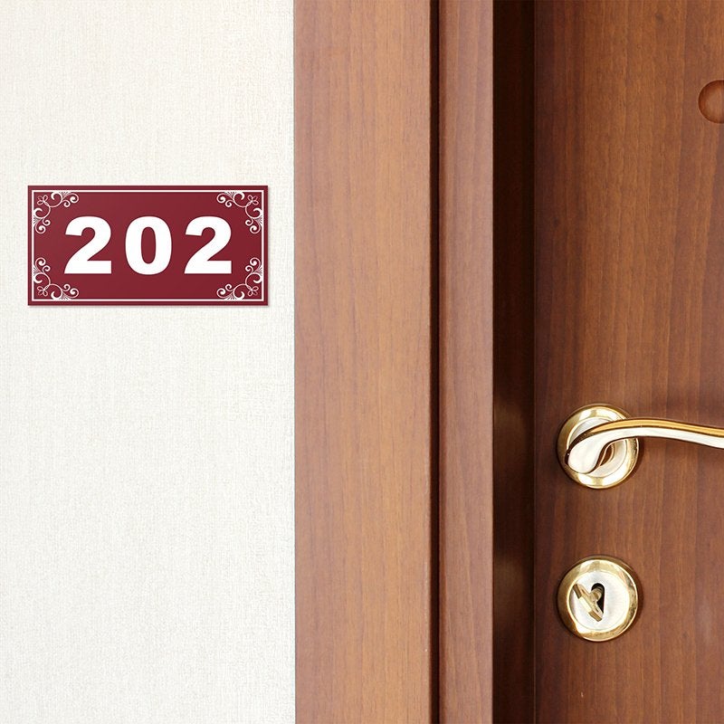 Engraved plastic sign for a room number