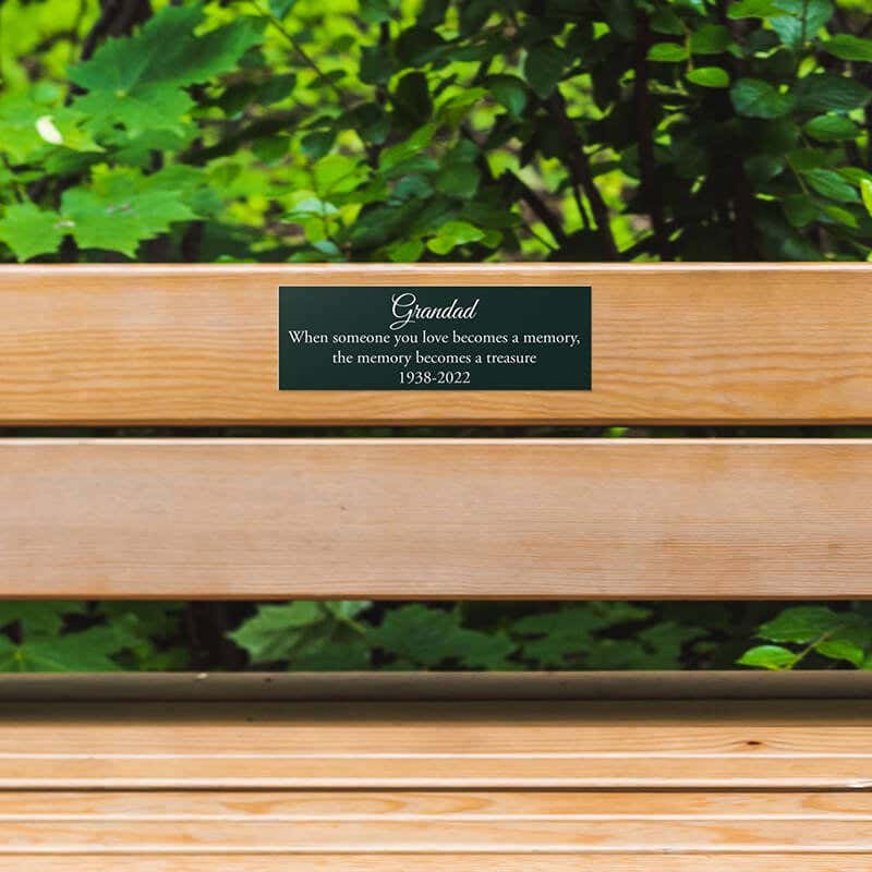2x6 plastic sign on a park bench