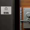 Engraved plastic sign for a room number
