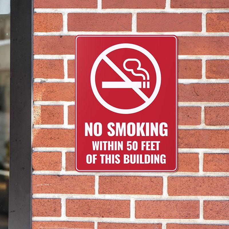 A red engraved no smoking sign