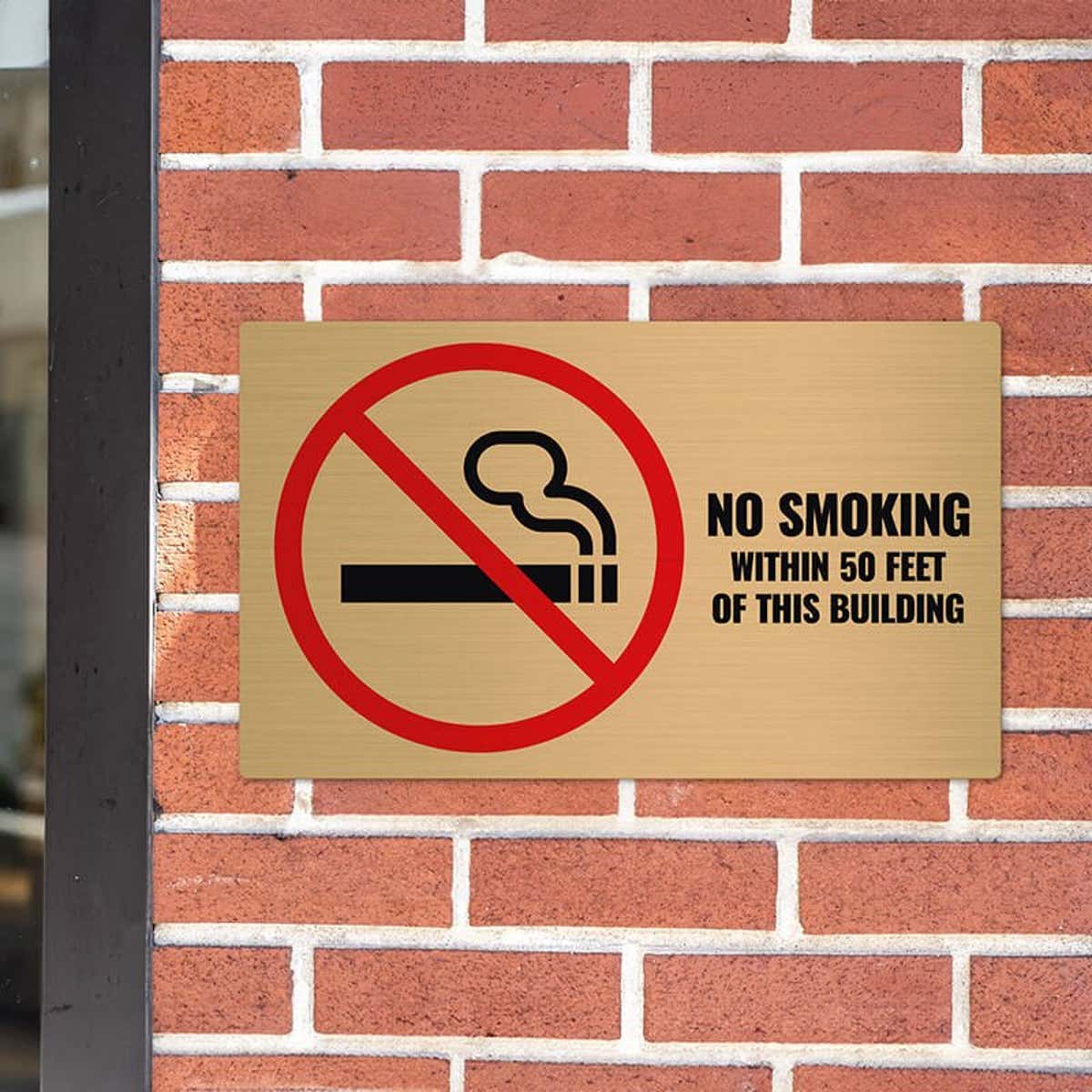 12x20 printed brass sign displayed on a brick wall