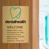 14x10 printed brass sign displayed in a dentist office