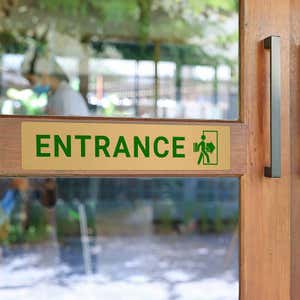 2x10 printed brass sign displayed on a front door