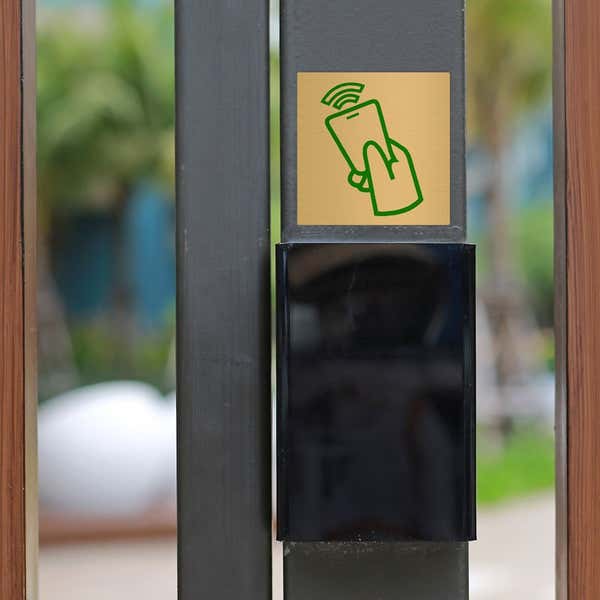 Custom printed brass sign with a green icon